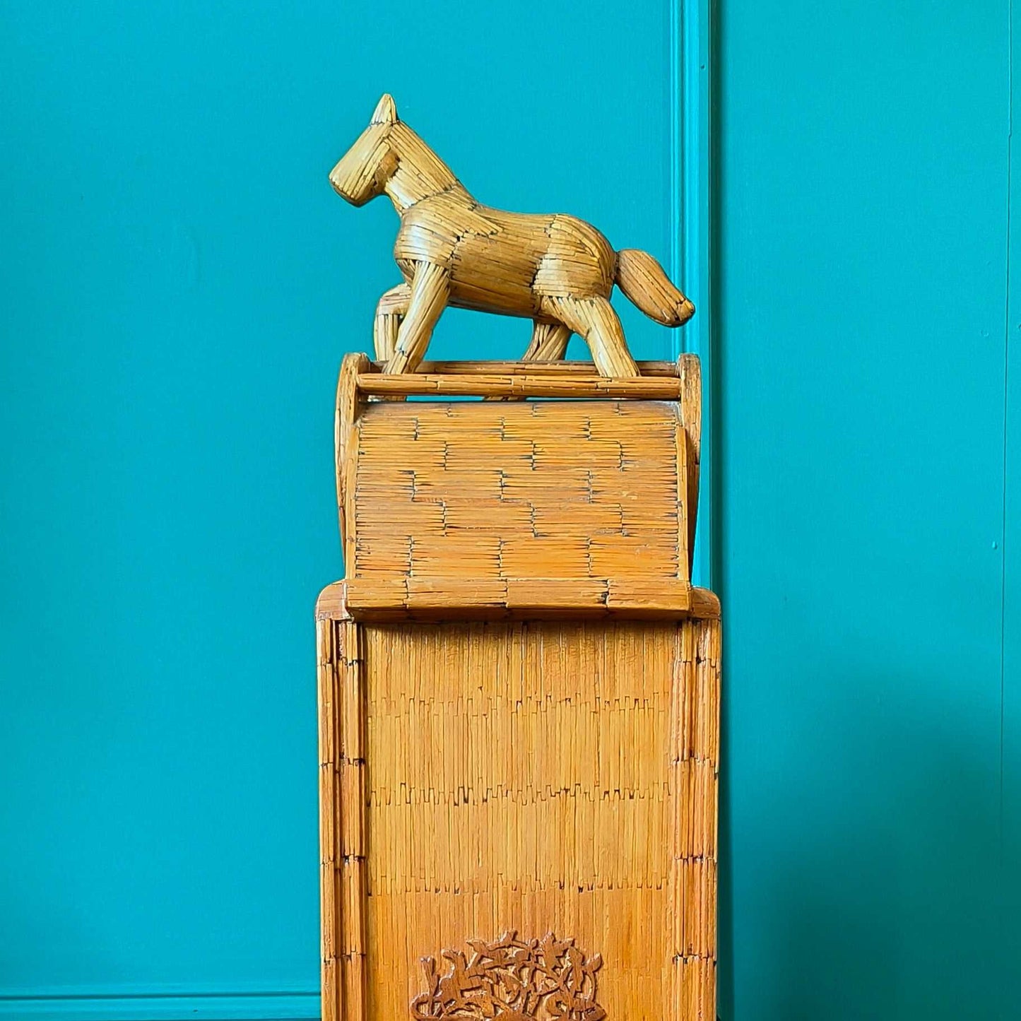 Likely German Mid-century. Constructed from matchsticks with a working clock and a drawer at the base.
Features a decorative horse figure on the very top.
Intricate jail-style folk Art.