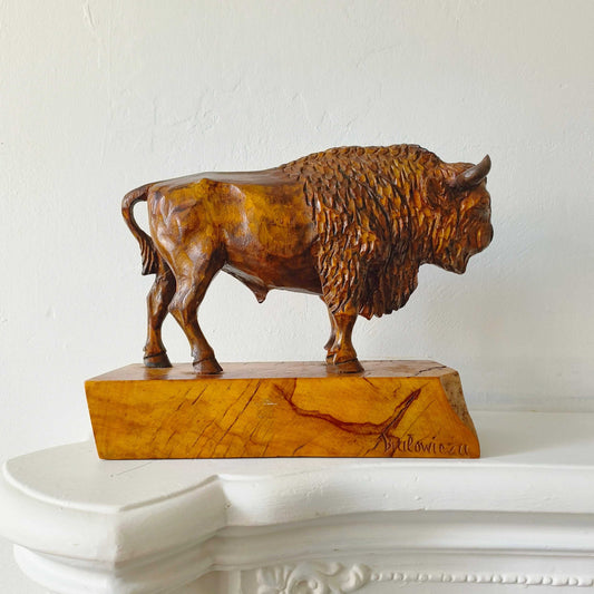 Vintage hand-carved wooden sculpture of a European Bison with detailed fur and muscles on wooden base