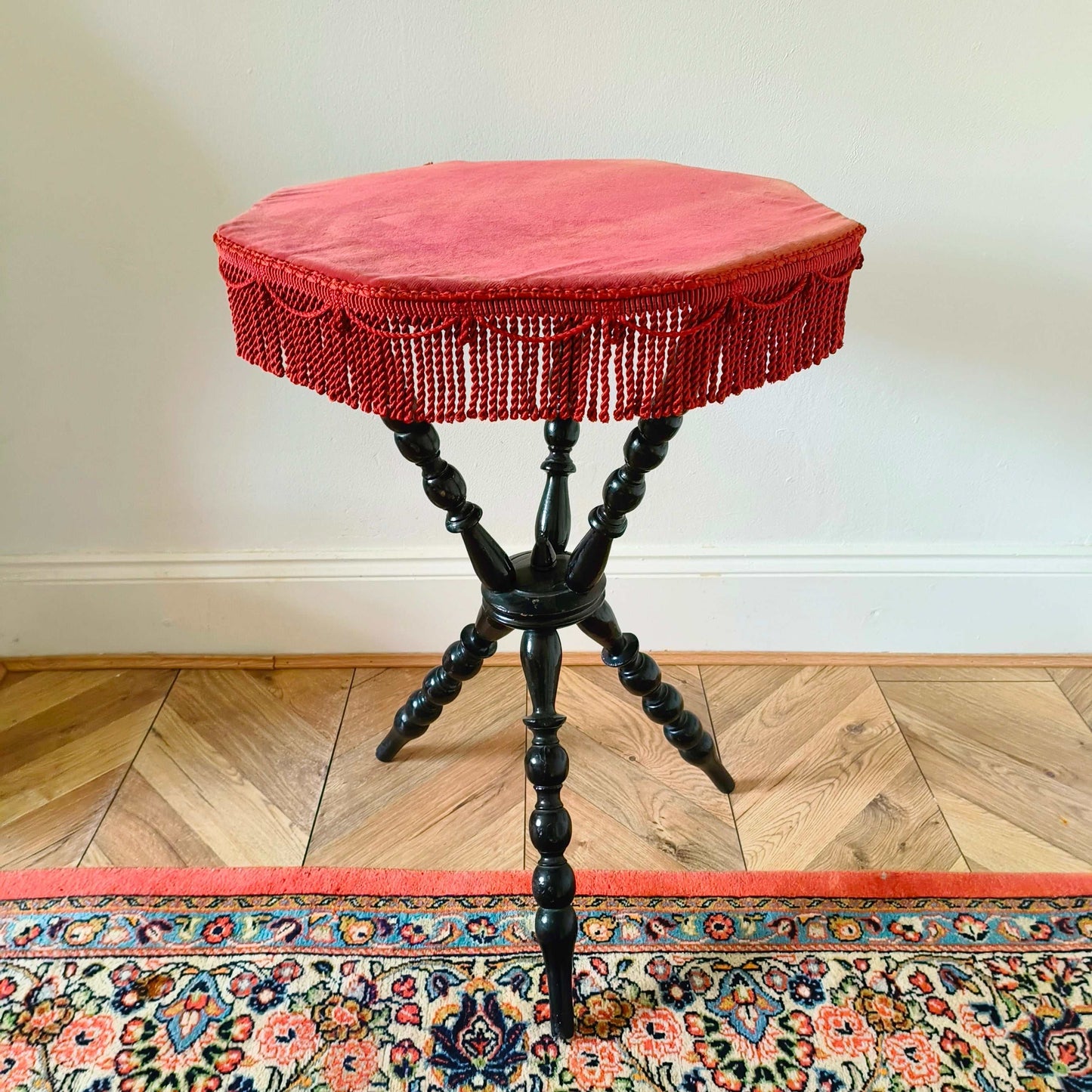 Antique Victorian gypsy table with red velvet octagonal top and ebonized bobbin turned legs