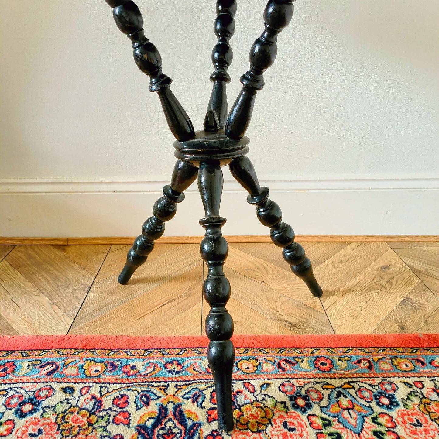 Antique Victorian gypsy table with red velvet octagonal top and ebonized bobbin turned legs