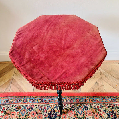 Antique Victorian gypsy table with red velvet octagonal top and ebonized bobbin turned legs
