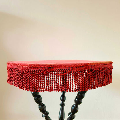 Antique Victorian gypsy table with red velvet octagonal top and ebonized bobbin turned legs