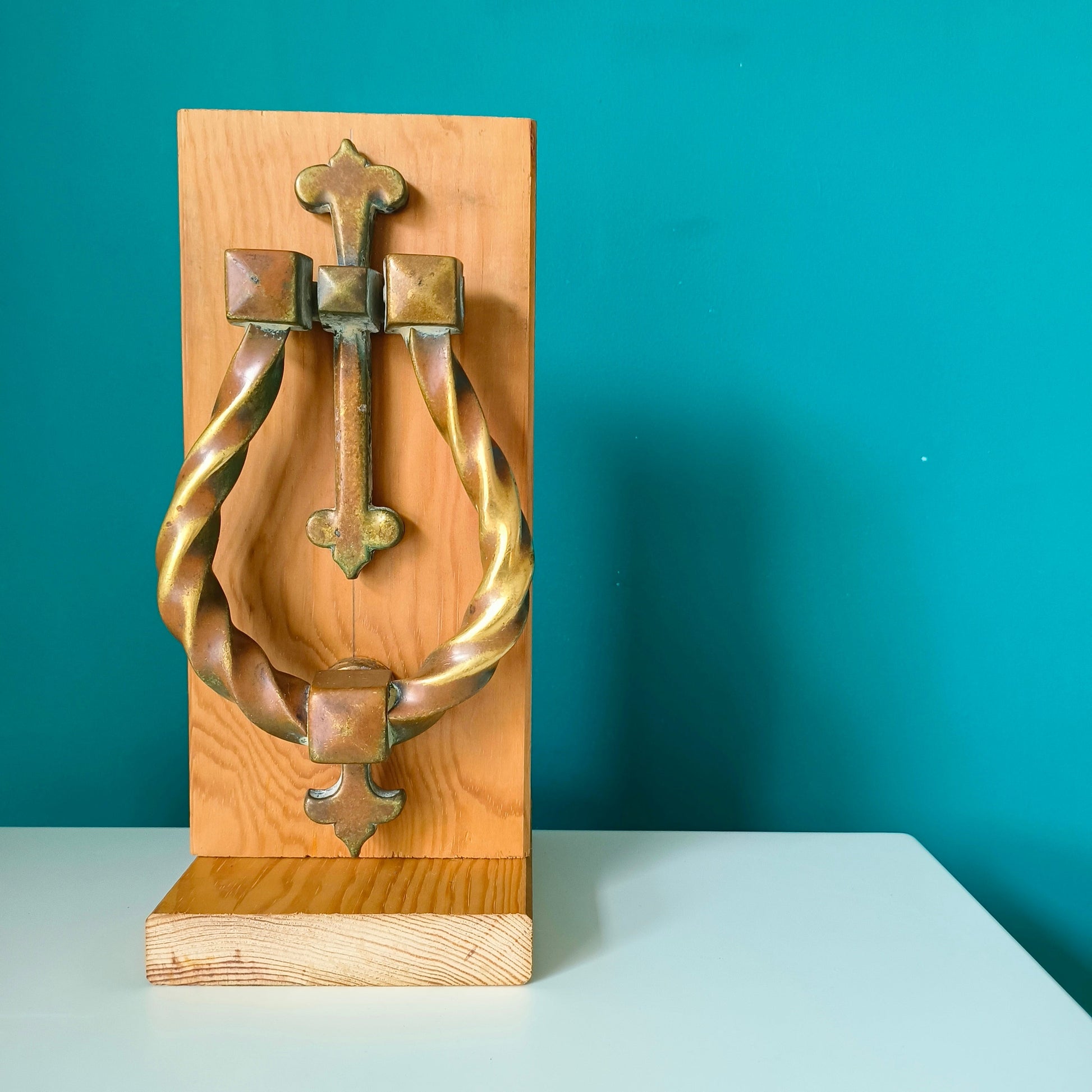 Large Gothic style brass door knocker with twisted ring design and rich patina finish