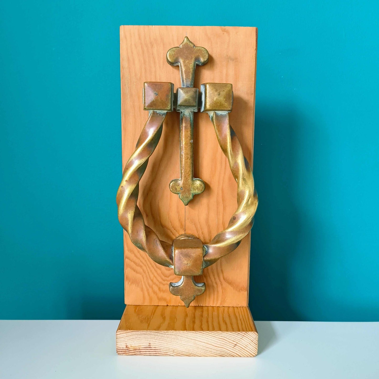 Large Gothic style brass door knocker with twisted ring design and rich patina finish