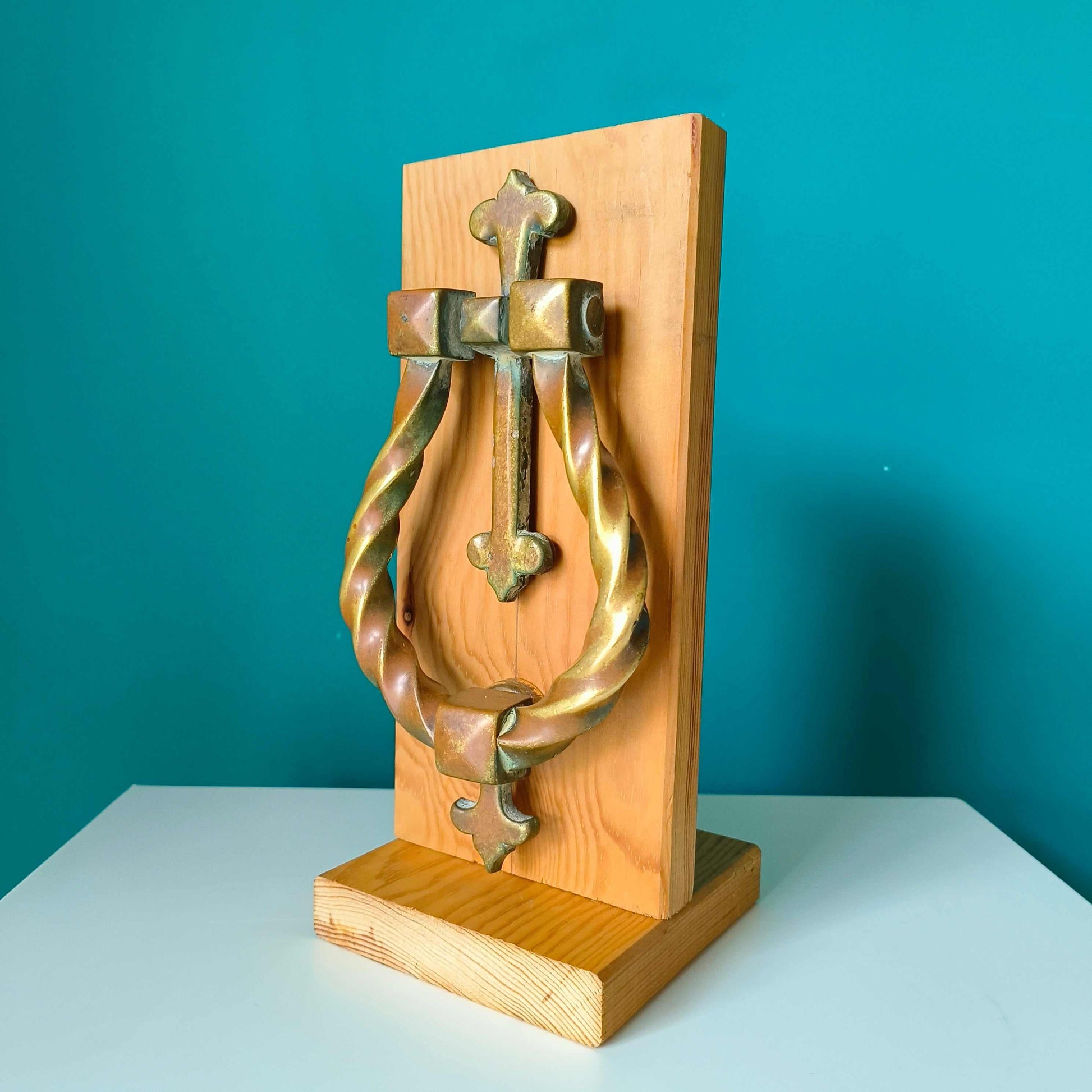 Large Gothic style brass door knocker with twisted ring design and rich patina finish
