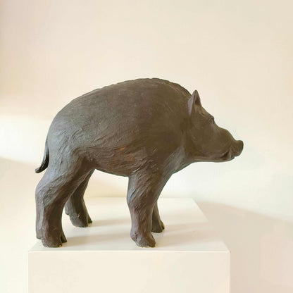 Vintage Italian wild boar statue carved from sandstone with brown patina, mid-century rustic décor piece