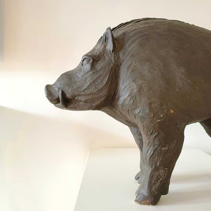 Vintage Italian wild boar statue carved from sandstone with brown patina, mid-century rustic décor piece