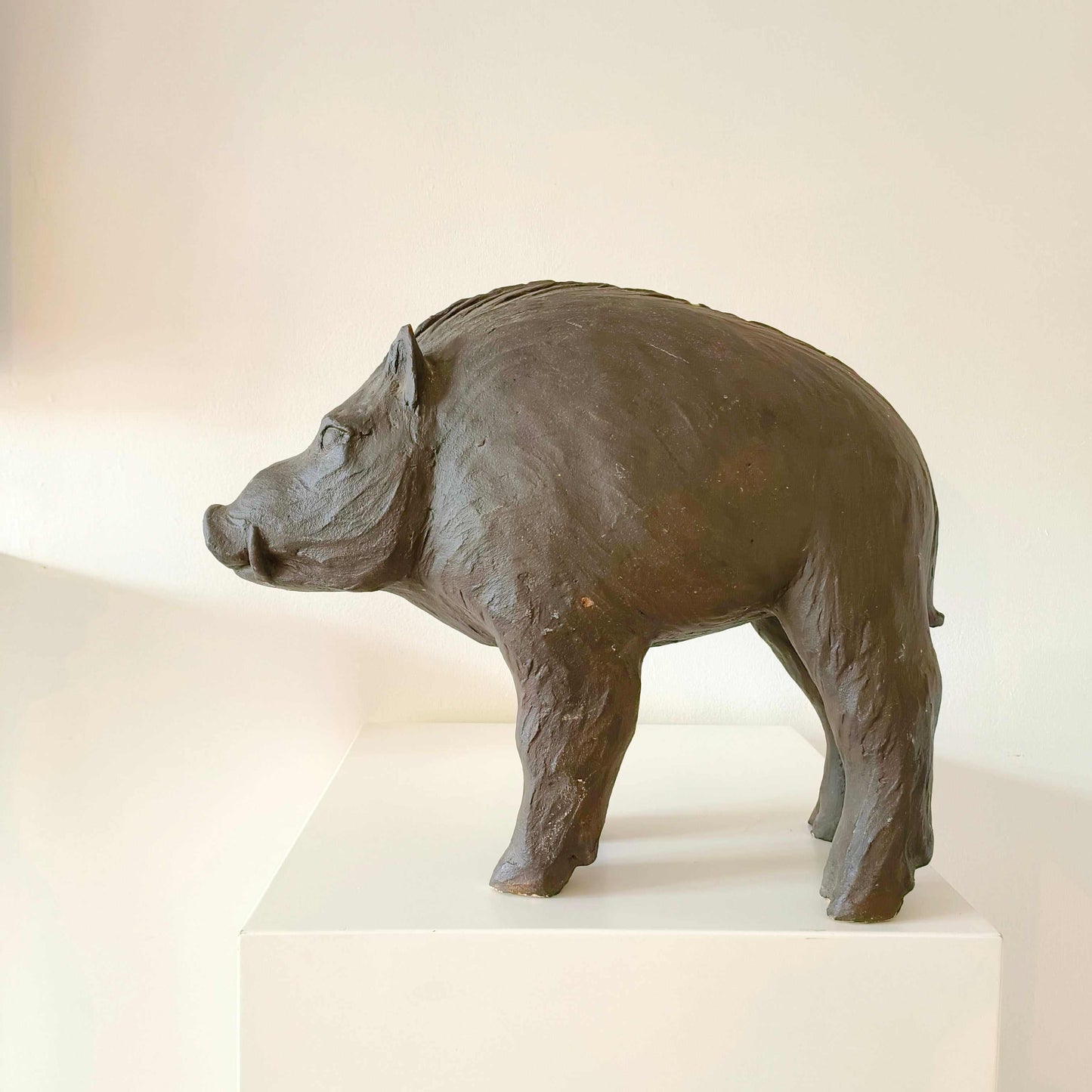 Vintage Italian wild boar statue carved from sandstone with brown patina, mid-century rustic décor piece