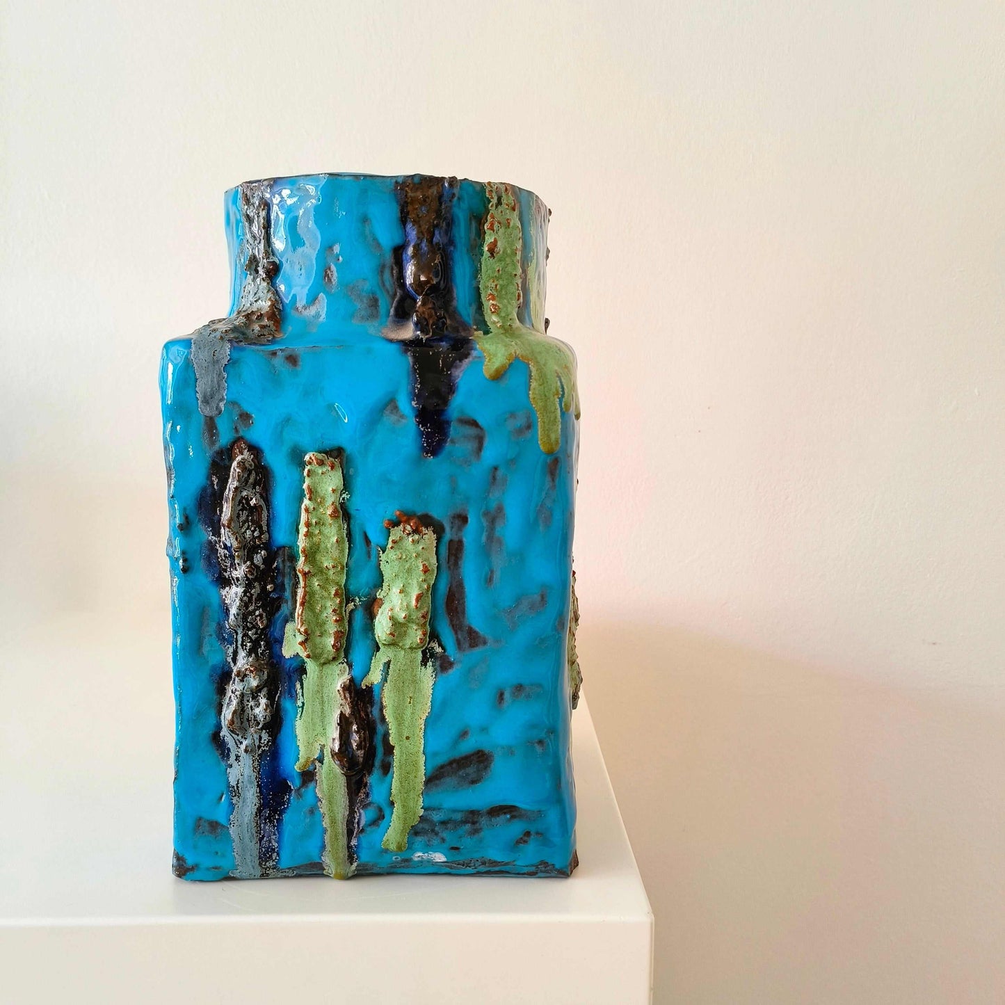 Vintage German studio pottery vase with turquoise blue, indigo, black, and mossy green textured accents