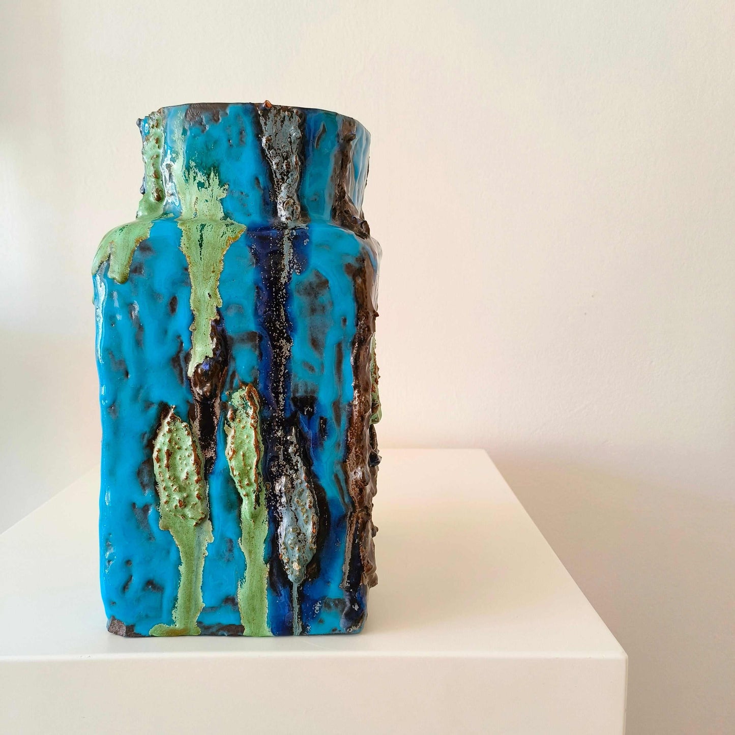 Vintage German studio pottery vase with turquoise blue, indigo, black, and mossy green textured accents