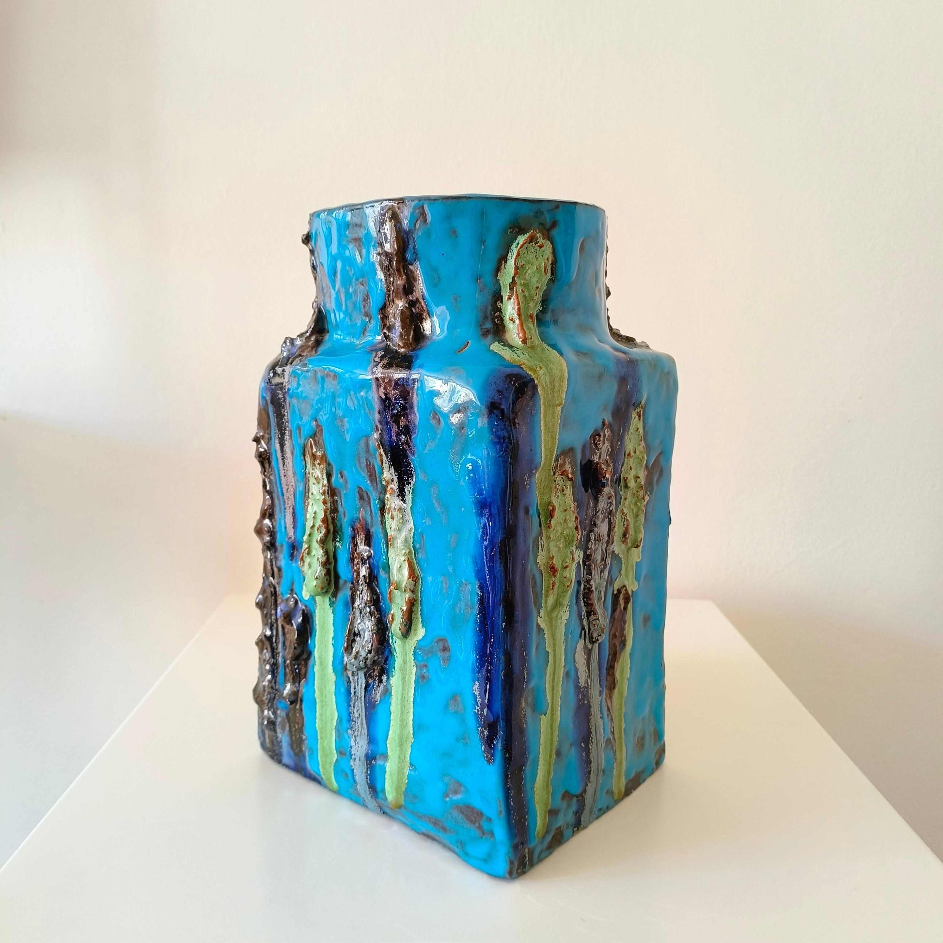 Vintage German studio pottery vase with turquoise blue, indigo, black, and mossy green textured accents