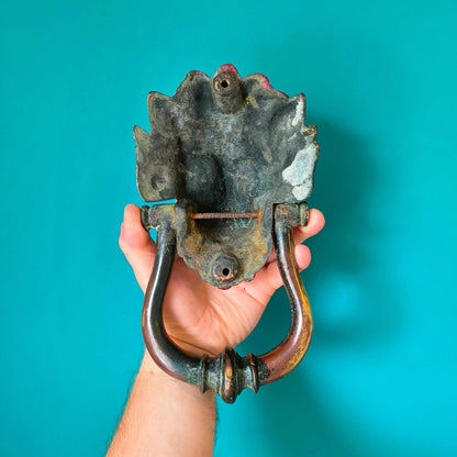 Victorian brass lion head door knocker with detailed lion face and ring handle