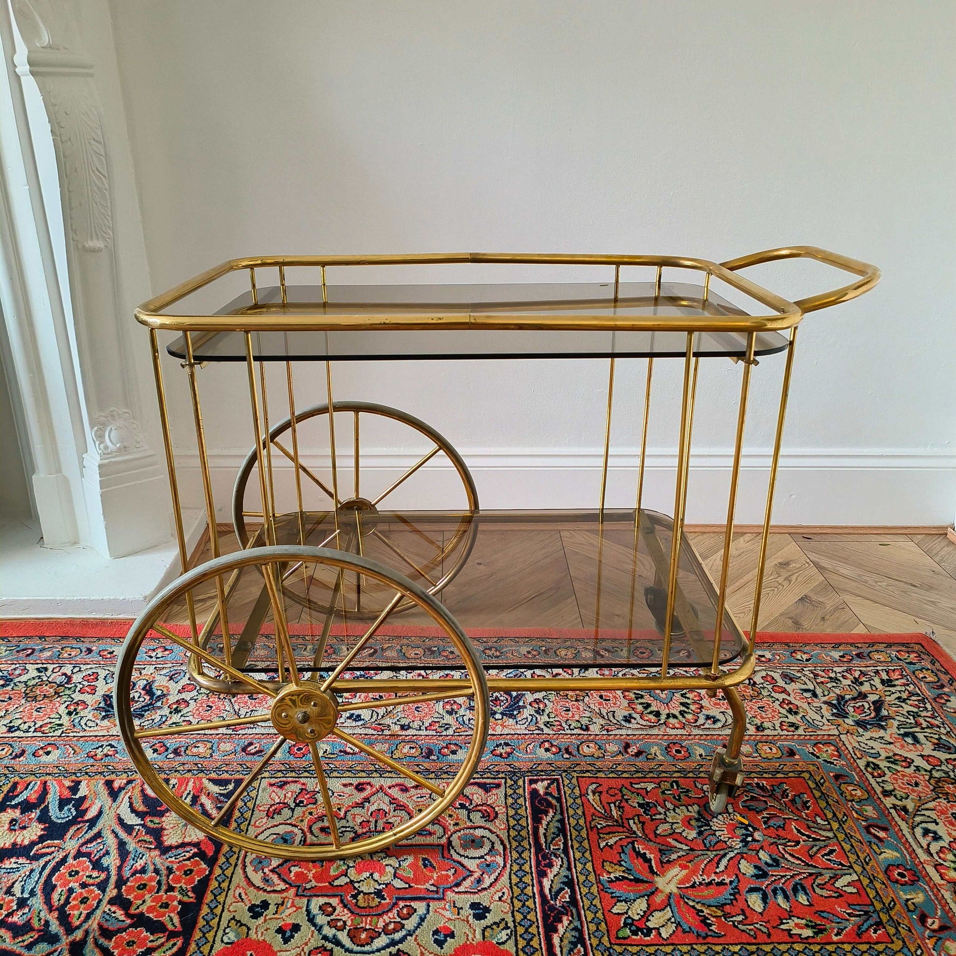 Vintage brass and smoke glass bar cart