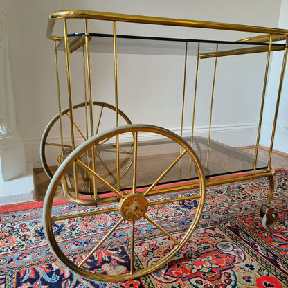 Vintage brass and smoke glass bar cart