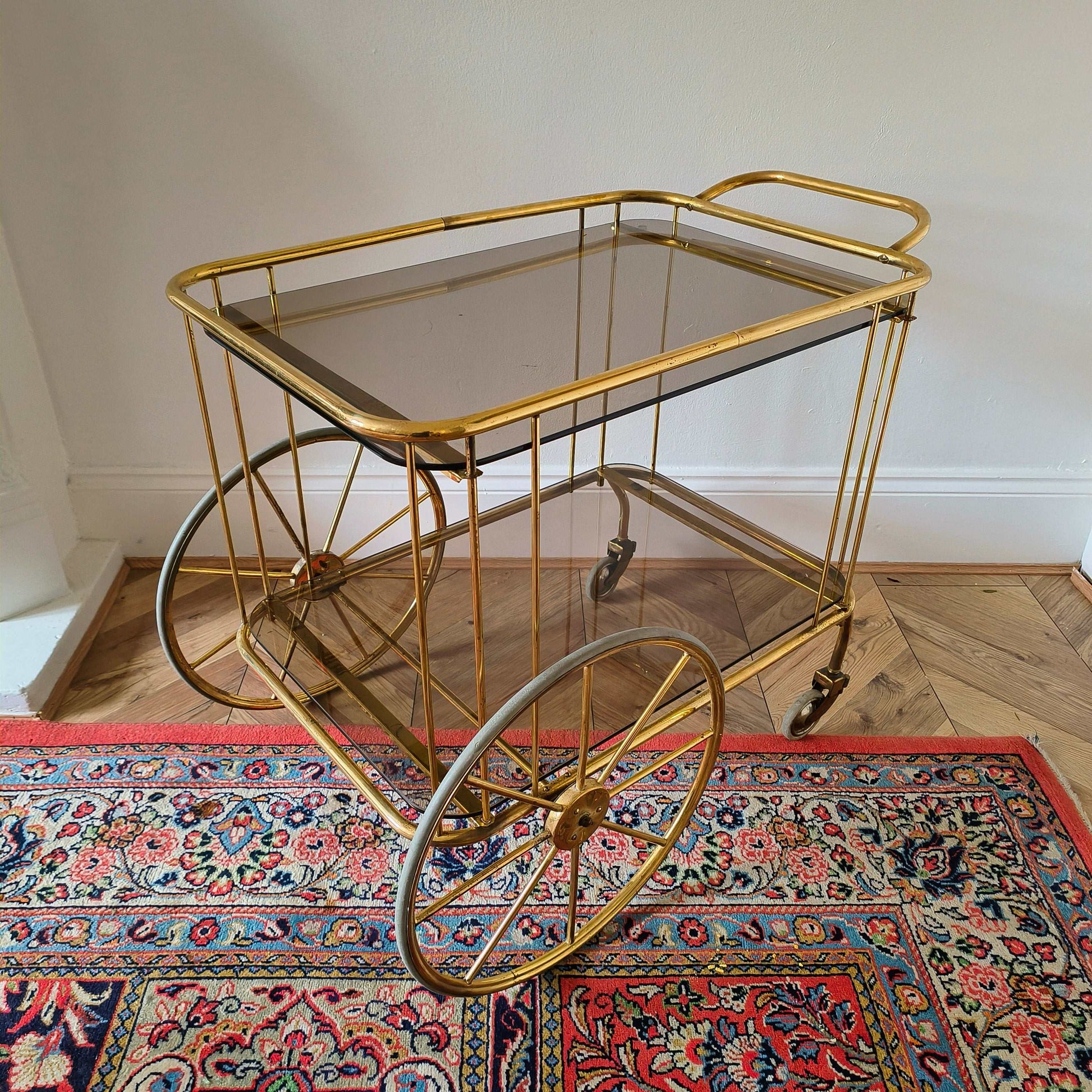 Vintage brass and smoke glass bar cart