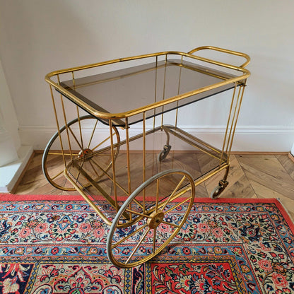 Vintage brass and smoke glass bar cart