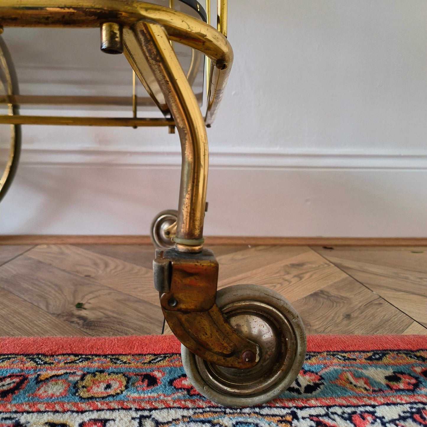 Vintage brass and smoke glass bar cart
