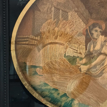 The Artwork is an oval embroidery on fine silk