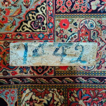 Lithographic limestone printing block featuring hand-drawn stone church tower with weather vane in rural landscape