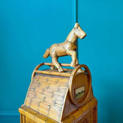 Likely German Mid-century. Constructed from matchsticks with a working clock and a drawer at the base.
Features a decorative horse figure on the very top.
Intricate jail-style folk Art.