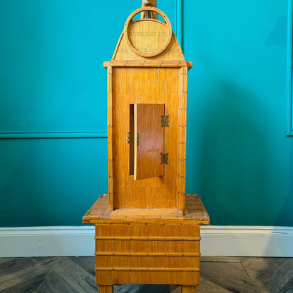 Likely German Mid-century. Constructed from matchsticks with a working clock and a drawer at the base.
Features a decorative horse figure on the very top.
Intricate jail-style folk Art.