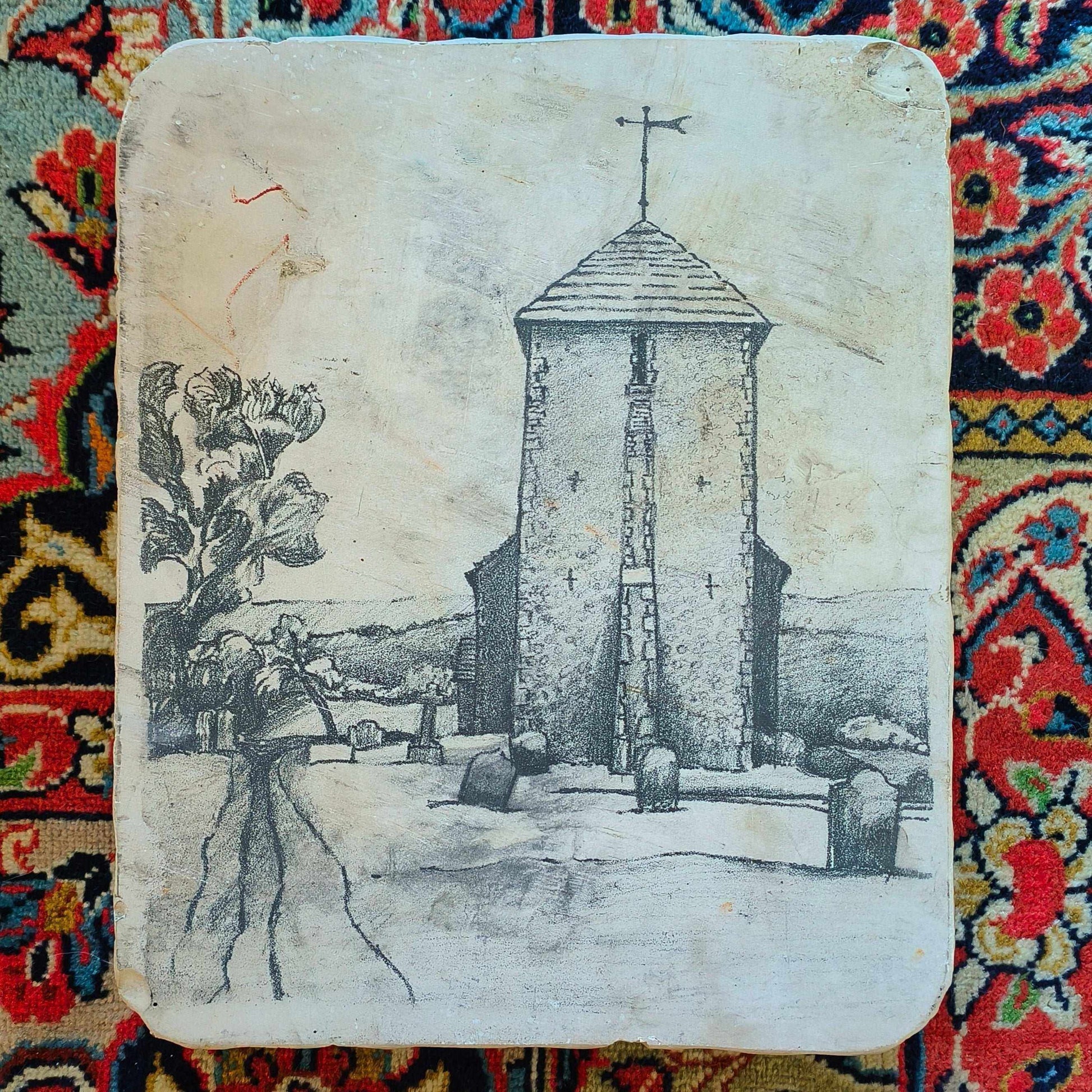 Lithographic limestone printing block featuring hand-drawn stone church tower with weather vane in rural landscape